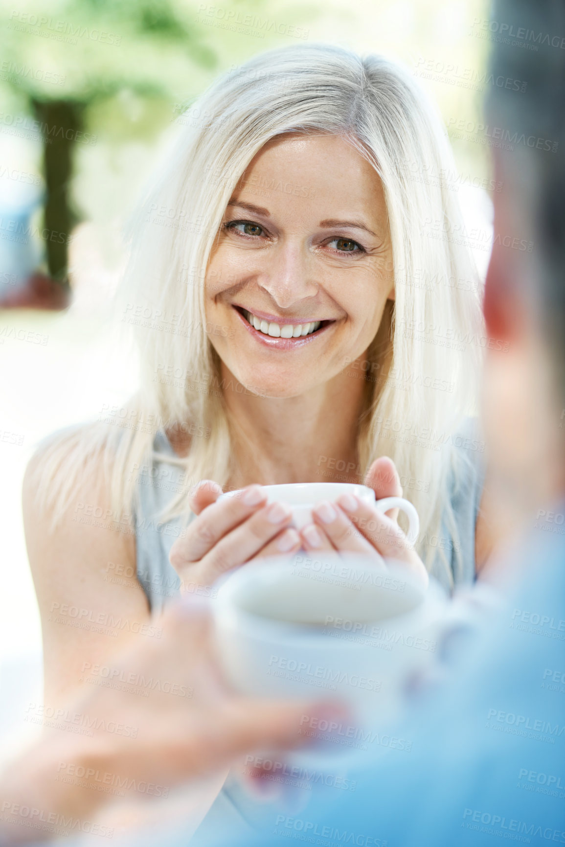 Buy stock photo Happy mature couple enjoying a cup of coffee outdoors