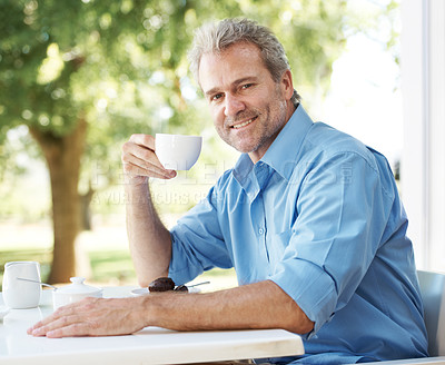 Buy stock photo Happy mature man enjoying a cup of coffee outdoors