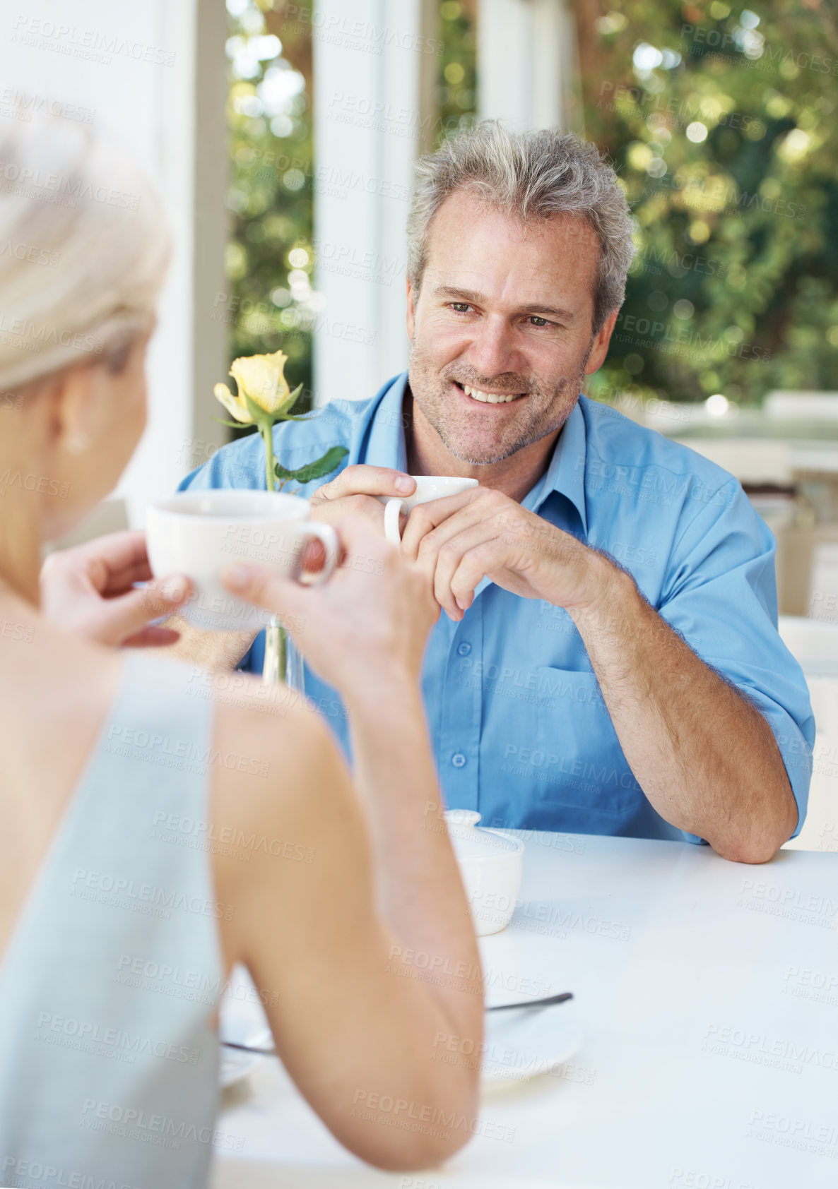 Buy stock photo Happy mature couple enjoying a cup of coffee outdoors