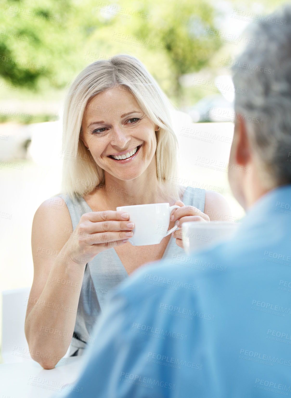 Buy stock photo Happy mature couple enjoying a cup of coffee outdoors