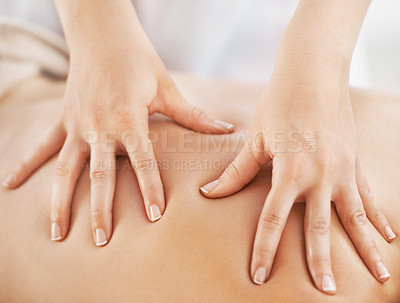 Buy stock photo Cropped view of a woman receiving a relaxing back massage