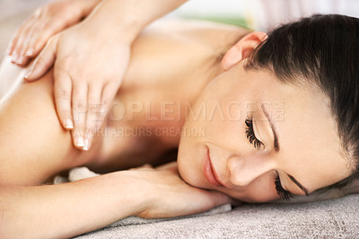 Buy stock photo A beautiful young woman getting a massage from a spa therapist