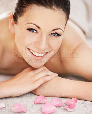 Buy stock photo Portrait, spa and woman with massage, petals and smile with happiness, natural beauty and luxury. Face, person and girl with weekend break, organic treatment and grooming with wellness and peaceful