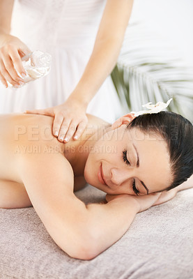 Buy stock photo Smile, massage and woman on table in spa for relax, skincare and holistic wellness for peace. Female person, zen and sleeping on bed for oil treatment, physical therapy and detox service in hotel