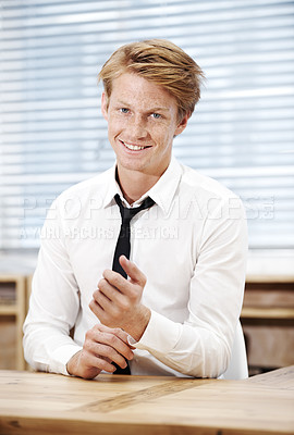 Buy stock photo Portrait, man and smile in office for startup, internship and professional in workplace. Male intern, confident and happy at desk for learning, opportunity or growth in company and ready for training