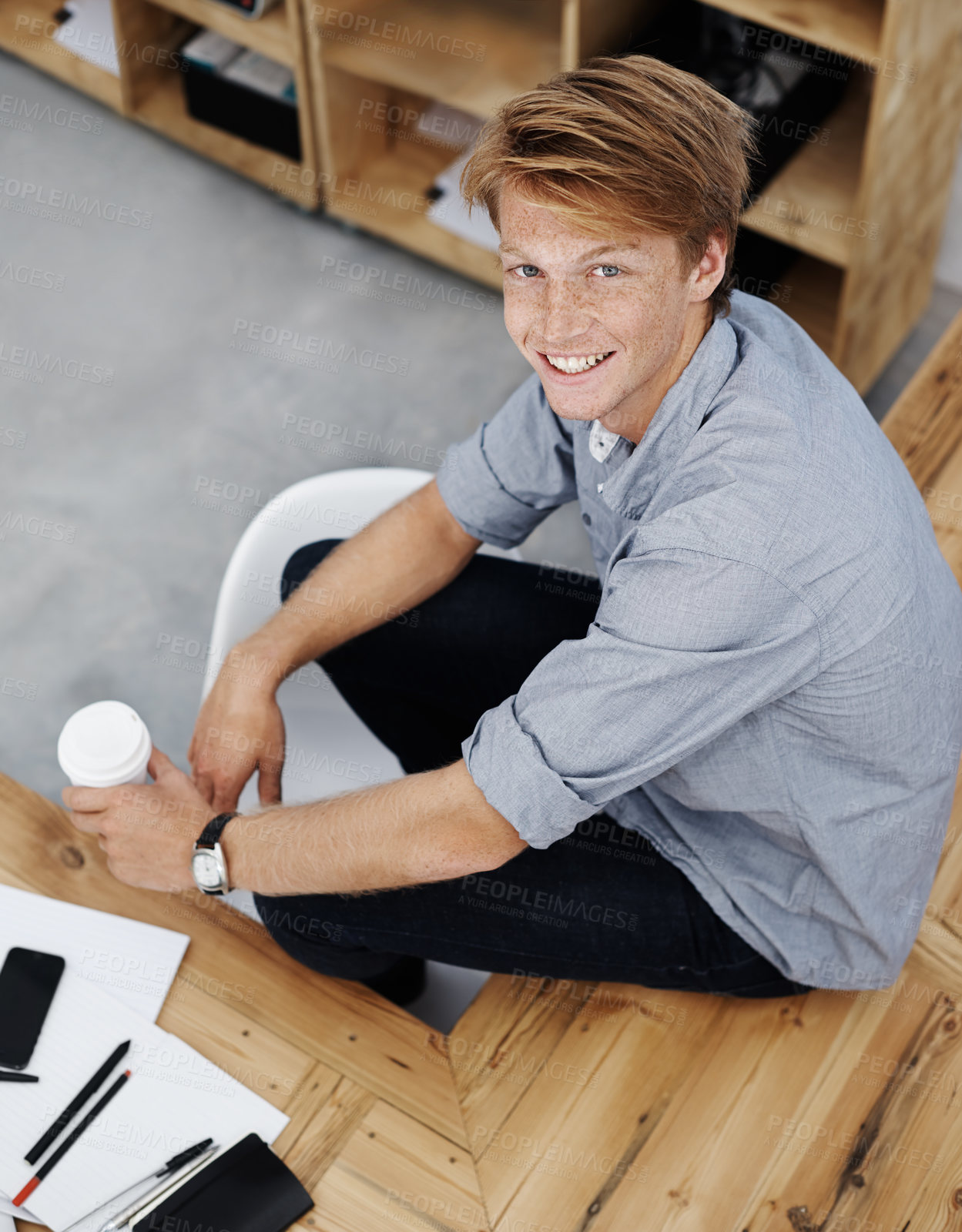 Buy stock photo Portrait, smile and man with coffee in office, graphic designer and startup for creative agency. Face, person and entrepreneur with morning tea, happiness and break for cappuccino, relax and joyful