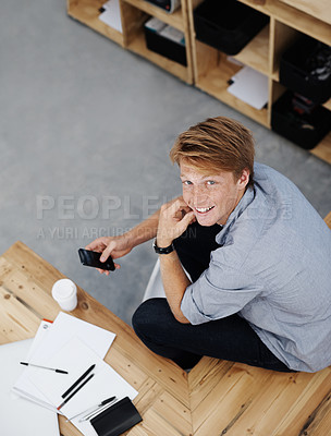 Buy stock photo Portrait, phone and happy business man in startup for social media or creative project. Face, smile and professional entrepreneur on smartphone for internet, research or top view of writer in Ireland