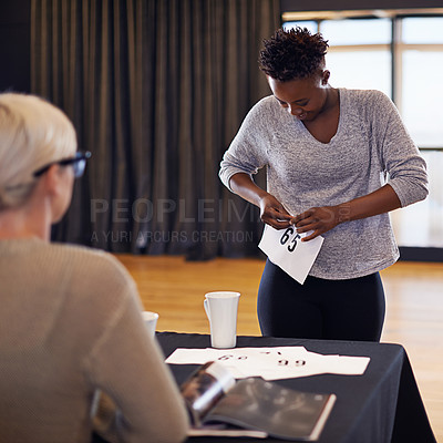 Buy stock photo Black woman, dancer and number in audition for performance art, contemporary project or talent show. Casting, contestant and judge in theatre for education, learning passion and coaching opportunity
