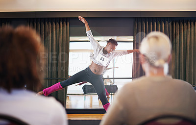 Buy stock photo Shot of a female dancer performing before the judges during a dance audition