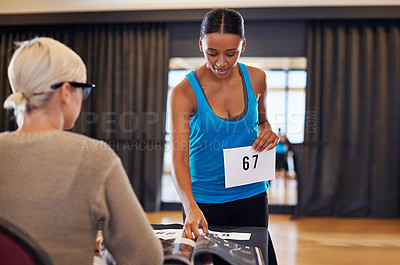 Buy stock photo Shot of a female dancer preparing for her dance audition