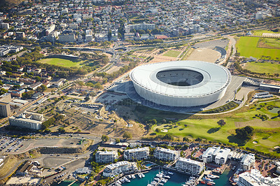 Buy stock photo Aerial view, stadium and city with buildings, sunshine and urban landscape with architecture. Empty, sports facility and nature by infrastructure and environment with development in Cape Town