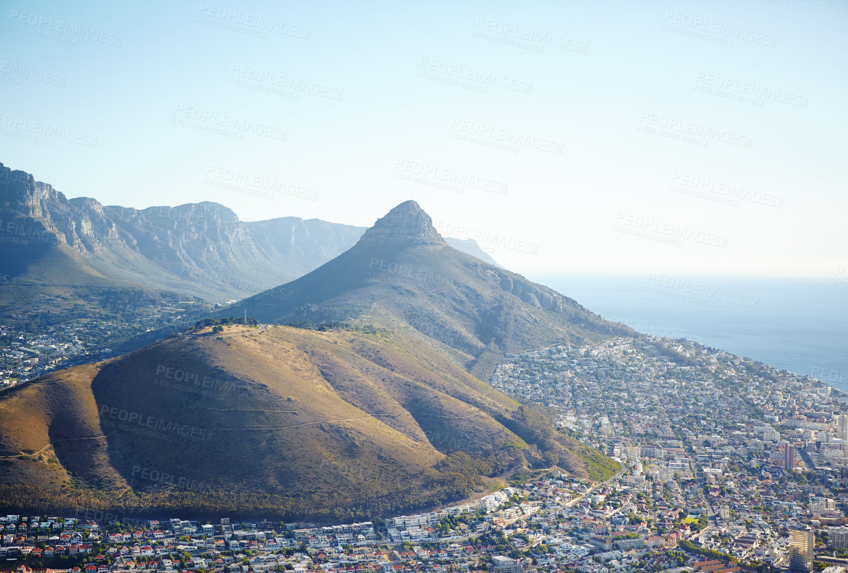 Buy stock photo Mountain, buildings and aerial view of landscape in nature for travel destination in city with blue sky. Infrastructure, rocks and town of scenic environment for tourism or holiday in Europe