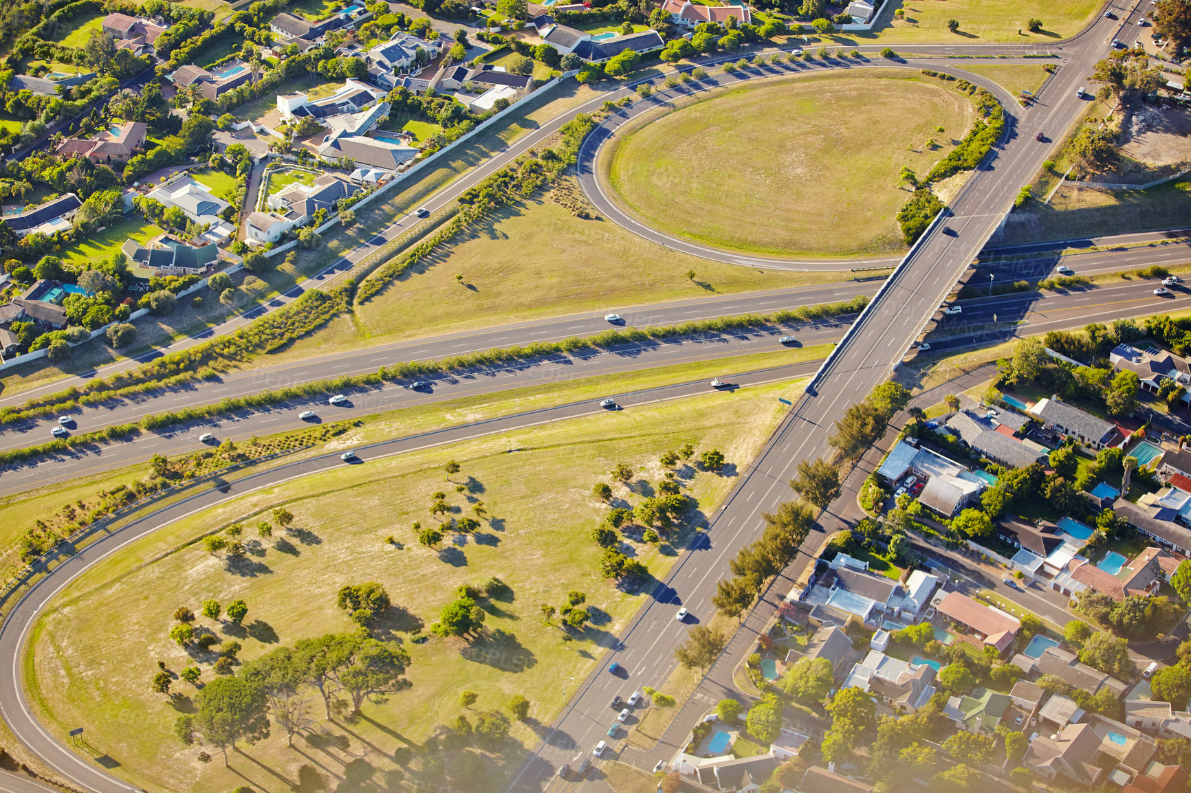 Buy stock photo Aerial view of a highway running through suburbs