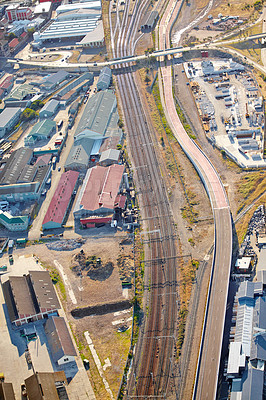 Buy stock photo Industrial, train park and aerial view of warehouse, factory and city district development. Urban, drone and manufacturing or production street for road, shipping and transportation for cargo