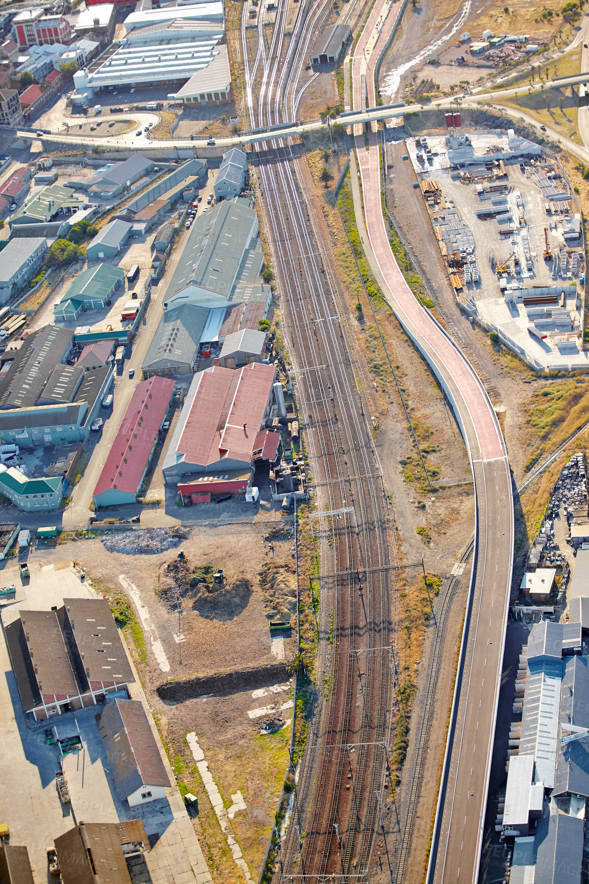 Buy stock photo Industrial, train park and aerial view of warehouse, factory and city district development. Urban, drone and manufacturing or production street for road, shipping and transportation for cargo