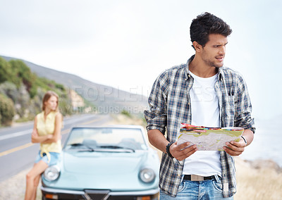 Buy stock photo Road trip, lost and man thinking with map outdoor for travel, vacation or holiday by car with woman. Couple, direction guide and transport for journey, adventure or confused with location destination