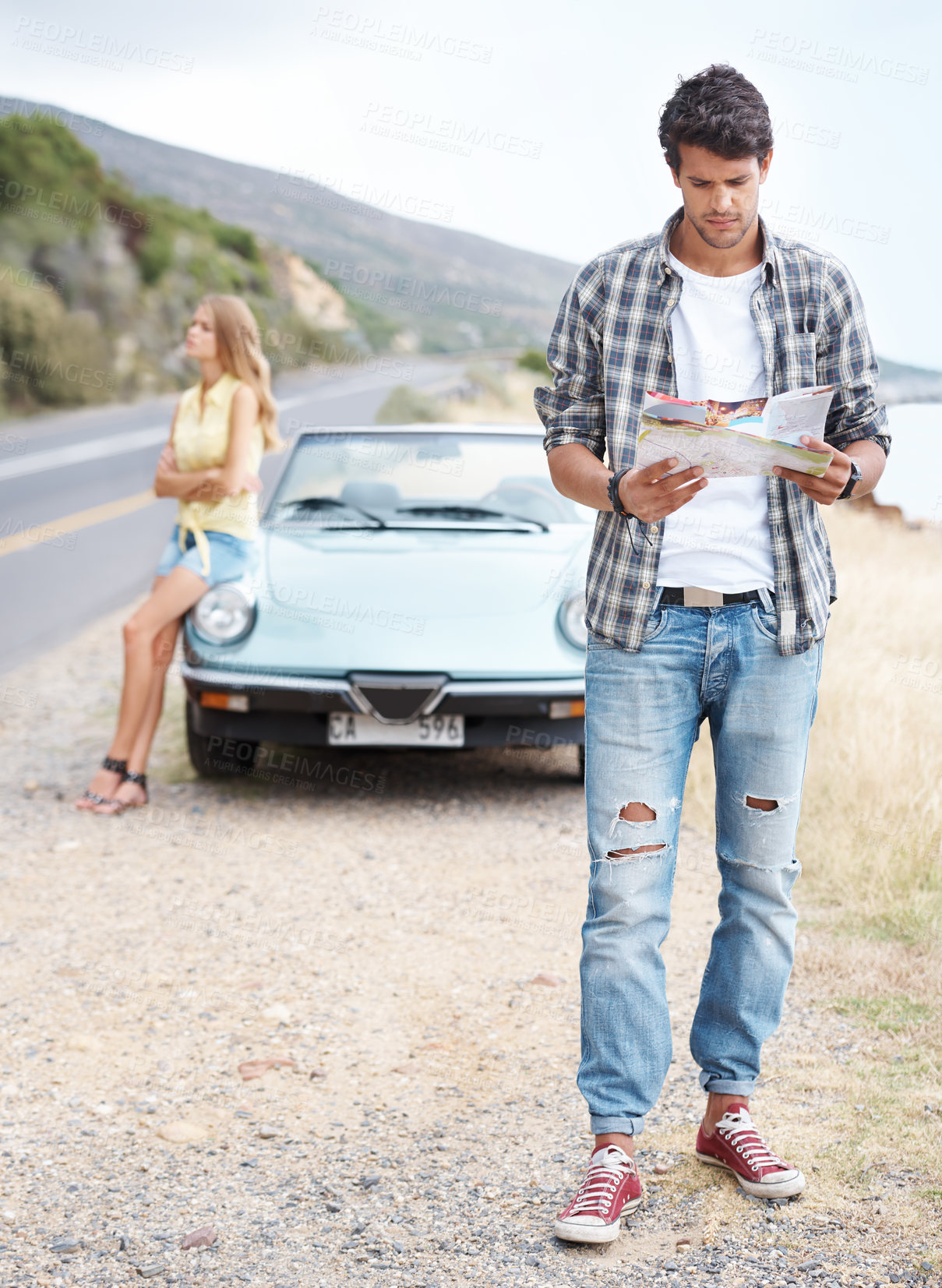 Buy stock photo Road trip confused and lost man with map for direction, holiday journey and search location for destination. Thinking, convertible car, and guy with stress for vacation travel and paper gps in France