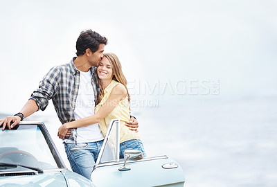 Buy stock photo Sea, kiss and happy couple hug on road trip in nature together for peace, travel or adventure. View, sky mockup space and people in car on vacation for journey, love and honeymoon romance in Italy