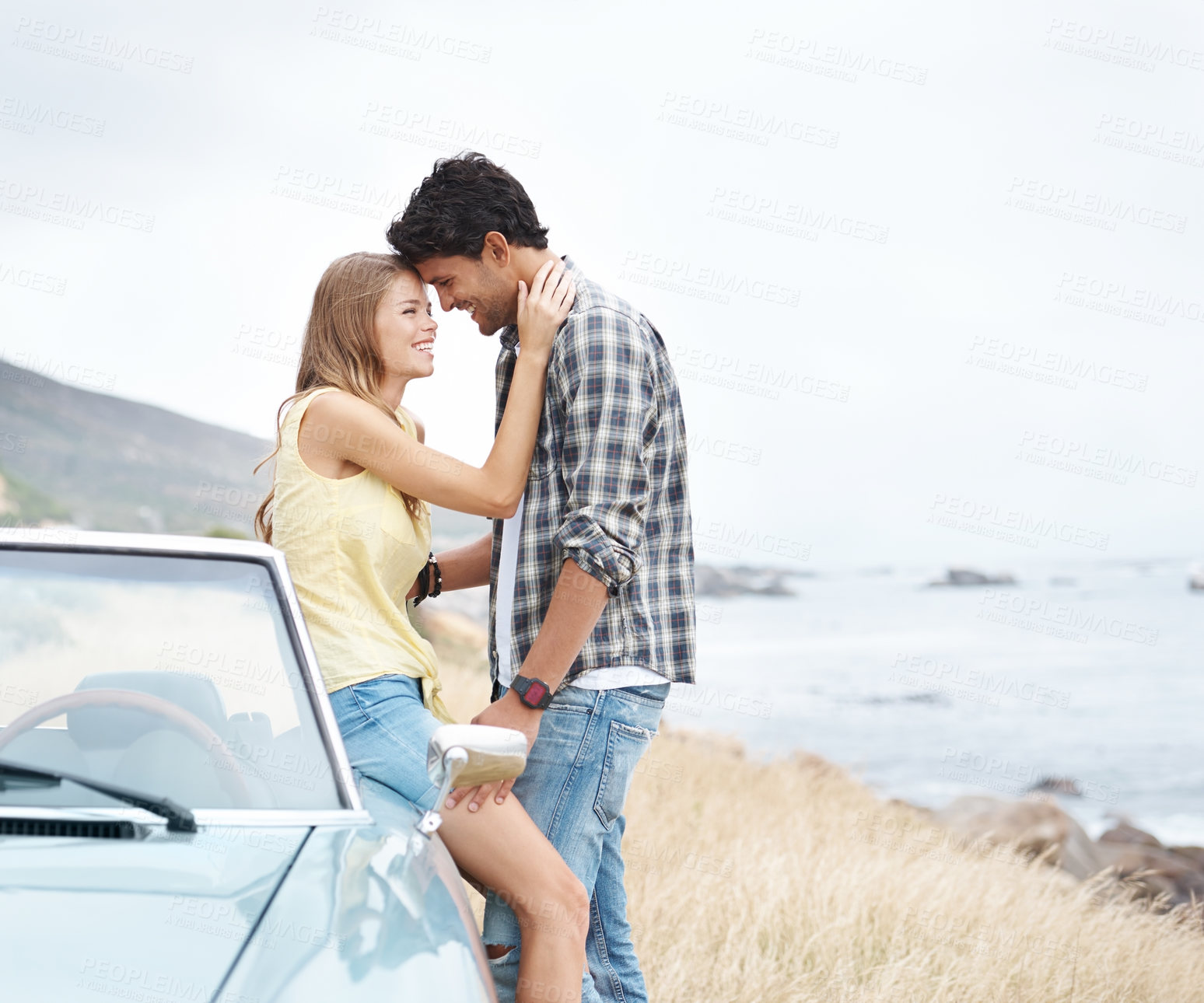 Buy stock photo Beach, love and happy couple on road trip on holiday together for break, ocean or adventure in nature. Memory, convertible and people in car vehicle for outdoor vacation for journey and honeymoon