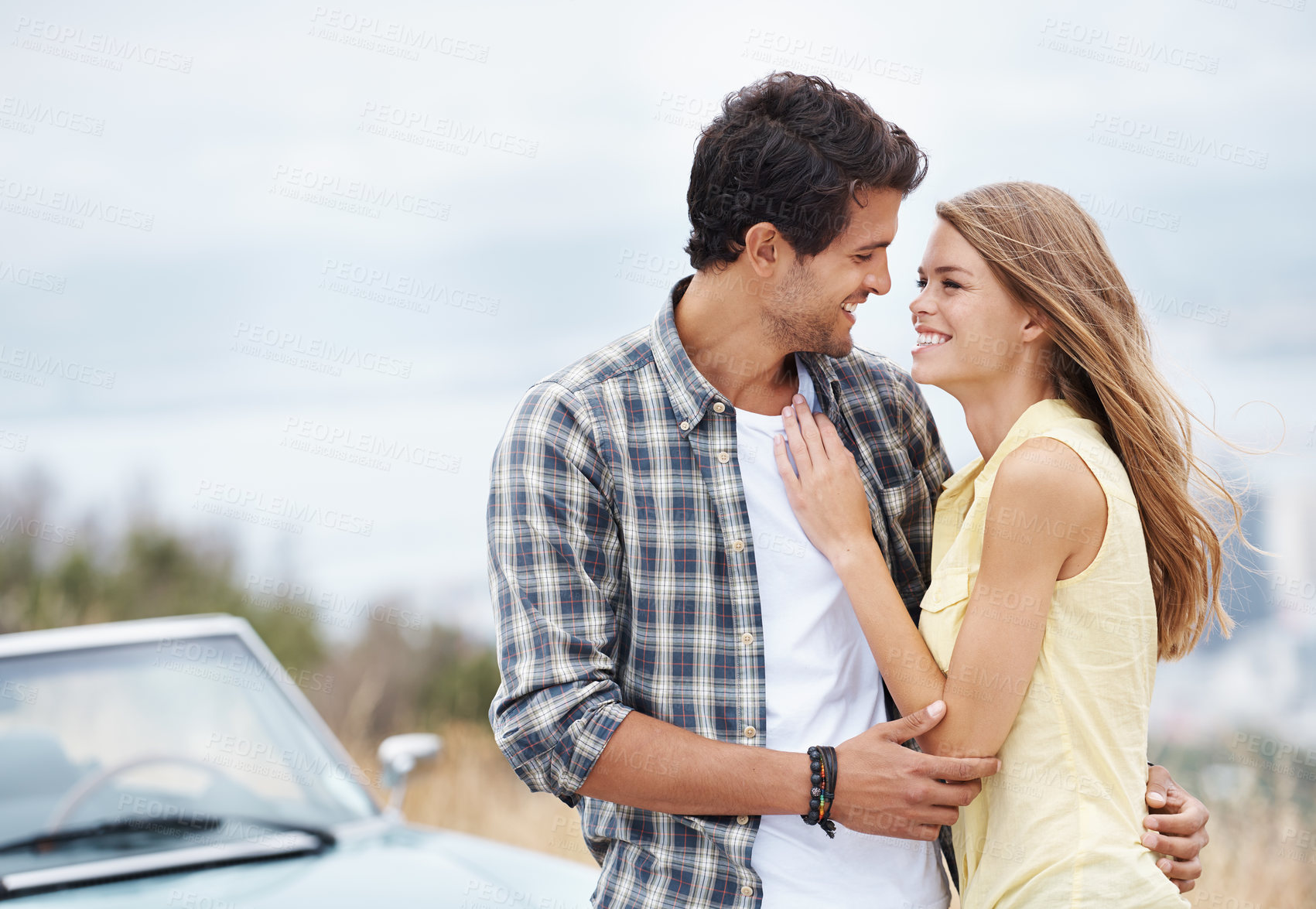 Buy stock photo Happy couple, hug and love with car for road trip, embrace or outdoor holiday together in nature. Man, woman or lovers with smile or vehicle on mountain or romantic date, journey or adventure outside