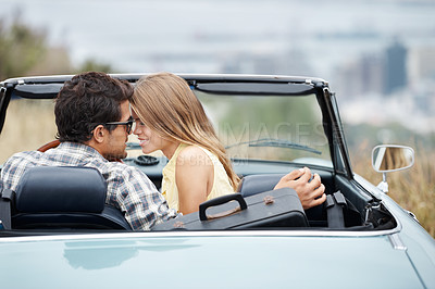 Buy stock photo Road trip, love and couple in car in city on holiday, vacation and adventure for bonding, romance and care. Travel destination, dating and man and woman embrace for transport, journey and together