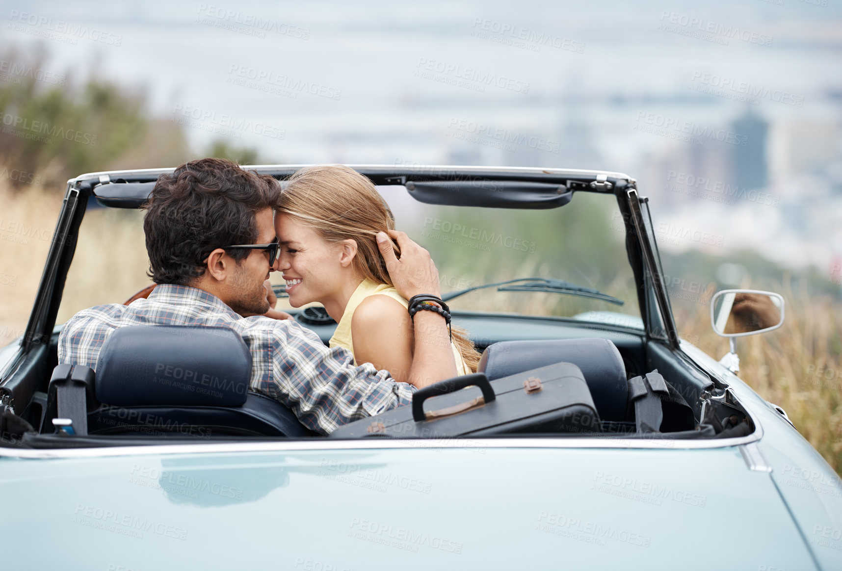 Buy stock photo Road trip, relax and couple in car in city on holiday, vacation and adventure for bonding, romance and love. Travel destination, dating and man and woman embrace for transport, journey and together