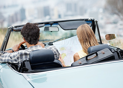 Buy stock photo Road trip, couple and reading map in car for travel, vacation and plan holiday by back of convertible outdoor. Man, woman and direction guide on transport for journey, adventure or drive to location