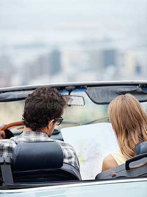 Buy stock photo Car, couple and reading map for travel on road trip, vacation and plan holiday by back of convertible outdoor. Man, woman and direction guide on transport for journey, adventure or drive to location