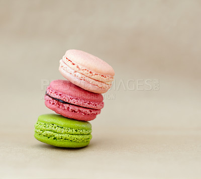 Buy stock photo Macaroons, dessert and stack of French sweets with variety, delicacy and treats on studio background. Baked candy, luxury and different flavors of confectionery for bakery, fine dining and cookies