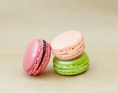 Buy stock photo Macaroons, candy and stack of French sweets with variety, delicacy and treats on studio background. Baked dessert, luxury and different flavors of confectionery for bakery, fine dining and cookies