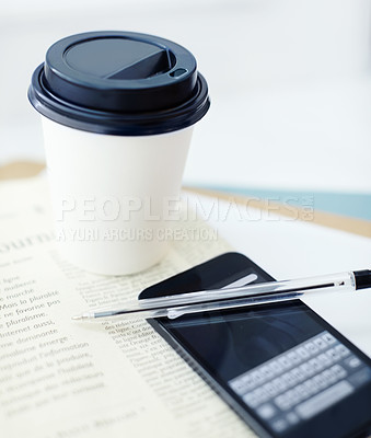 Buy stock photo Image of a smartphone on a newspaper with a pen on top of it, and a disposable coffee cup