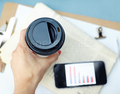 Buy stock photo Drinking coffee, top view and closeup of hands with phone data, newspaper or information. Cup, tea or woman with beverage above for financial analyst with graph, chart or statistics on smartphone app