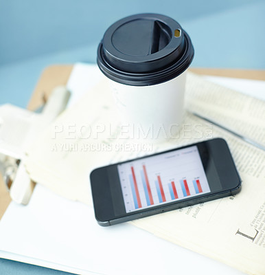 Buy stock photo Coffee, business newspaper and empty office with phone at company on clipboard in room. Cup, drink and news journal with mobile on desk for data, chart or graph on screen with information in top view