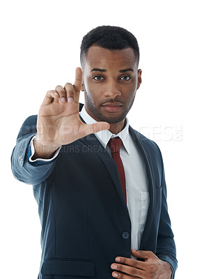 Buy stock photo A handsome young businessman using his hands to convey his vision
