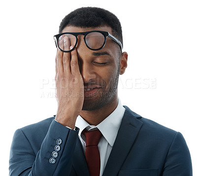 Buy stock photo A young businessman rubbing his face with a smile while isolated on white