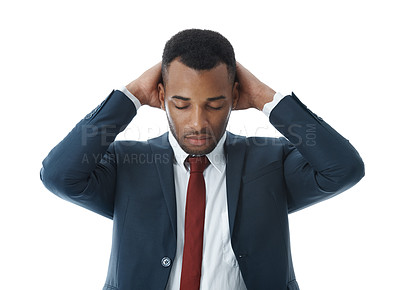 Buy stock photo A worried young businessman with his hands on his head