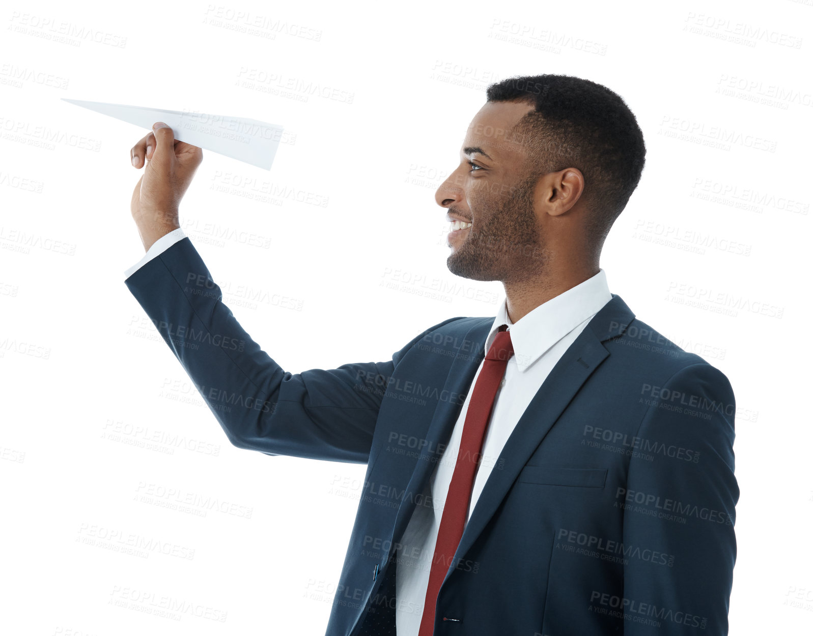 Buy stock photo A businessman holding a folded paper plane while isolated on white