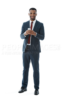 Buy stock photo A handsome young businessman isolated on white while using his mobile