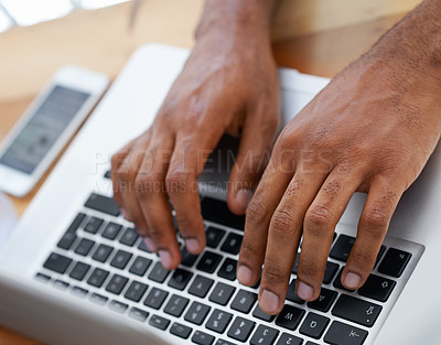 Buy stock photo Cropped view of a businessman's hands as he types on his laptop