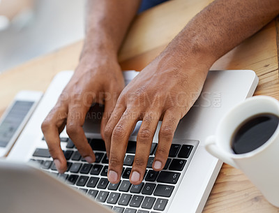 Buy stock photo Cropped view of a businessman's hands as he types on his laptop