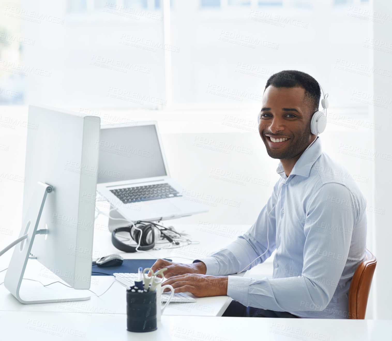 Buy stock photo Black man, computer and music for working portrait, online and streaming audio on office internet. Male person, cloud computing and feedback for html code, programming and headphones for podcast