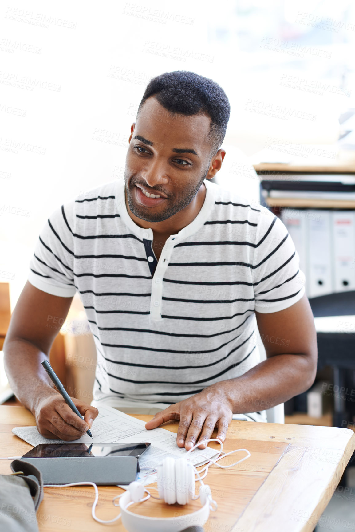 Buy stock photo Black man, paper and thinking in startup office, tablet and research for notes of information. Male person, entrepreneur and documents for feedback report, writing ideas and reflection on business