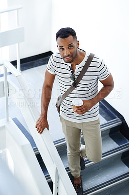 Buy stock photo Portrait, walking and businessman on steps with coffee, trendy outfit and smile for designer startup. Black man, takeaway and African guy with creative fashion, morning style and cool commute