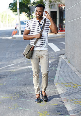 Buy stock photo Black man, headphones and outdoor for street commute, walking and listening to music in city. Male person, student and streaming sound or audio on journey to college, travel and podcast in urban town