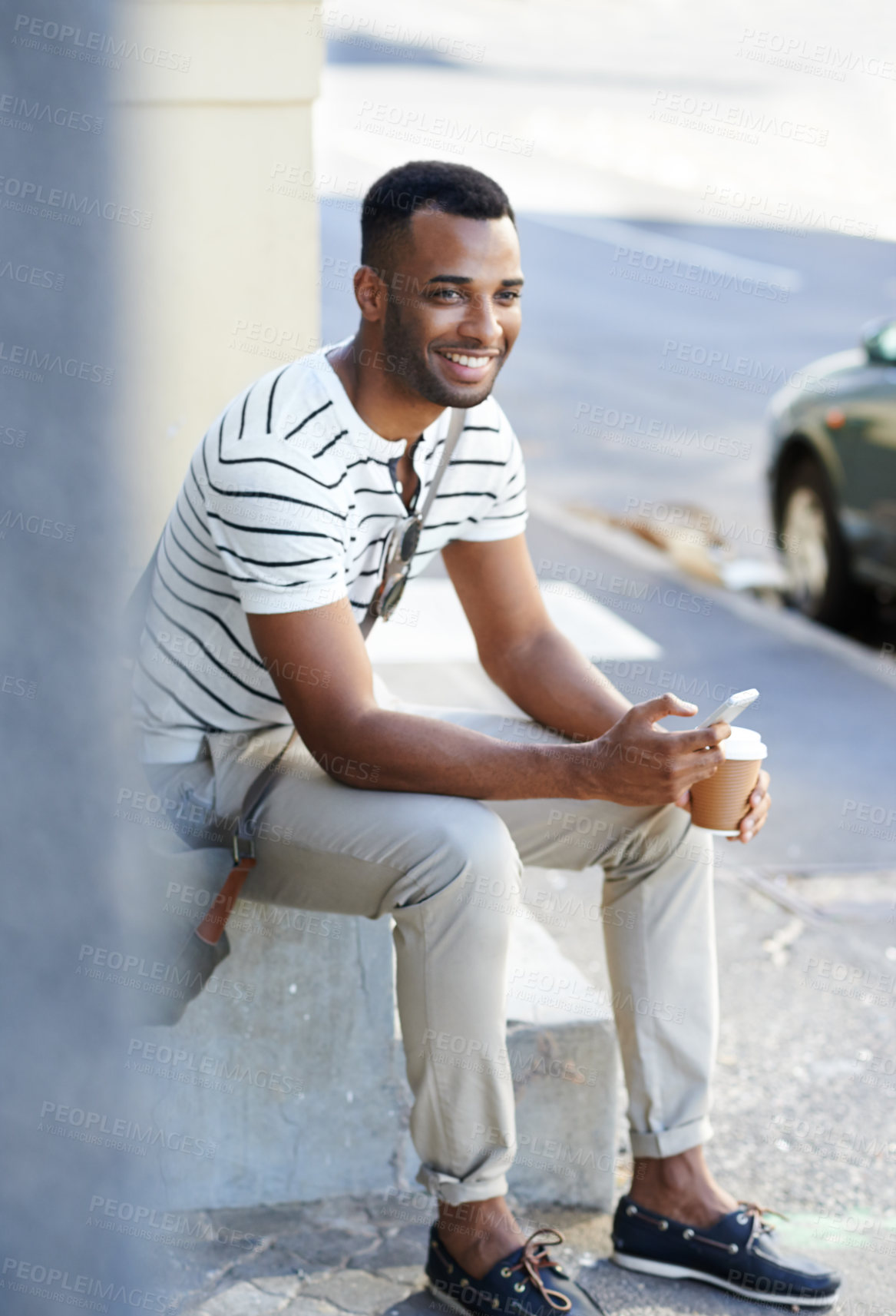 Buy stock photo Black man, coffee and phone in city for business, positivity and relax in afternoon. Male person, tech and smile on sidewalk for support local, new opportunity or commute to job interview in New York