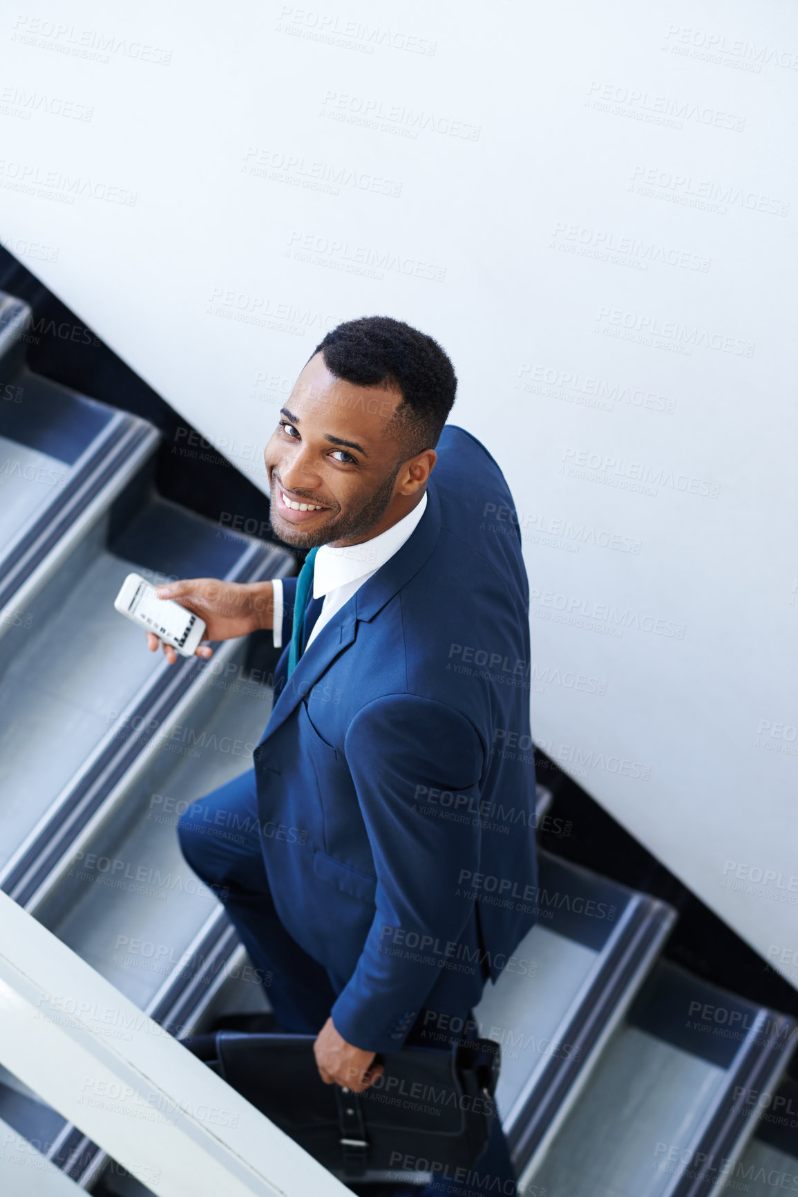 Buy stock photo Steps, smile and portrait of black man with phone, bag and appointment in law firm, above and of employee. Professional, attorney and cellphone for communication in office, stairs and person in USA