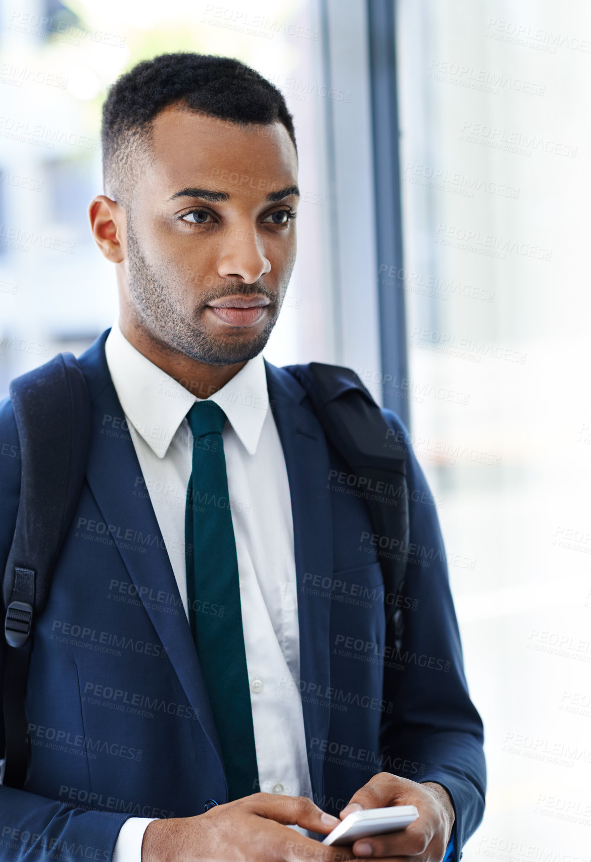 Buy stock photo Thinking, black man and phone in office for business, communication and email response. Male intern, mobile and new day at company for networking, information update and typing in morning at law firm