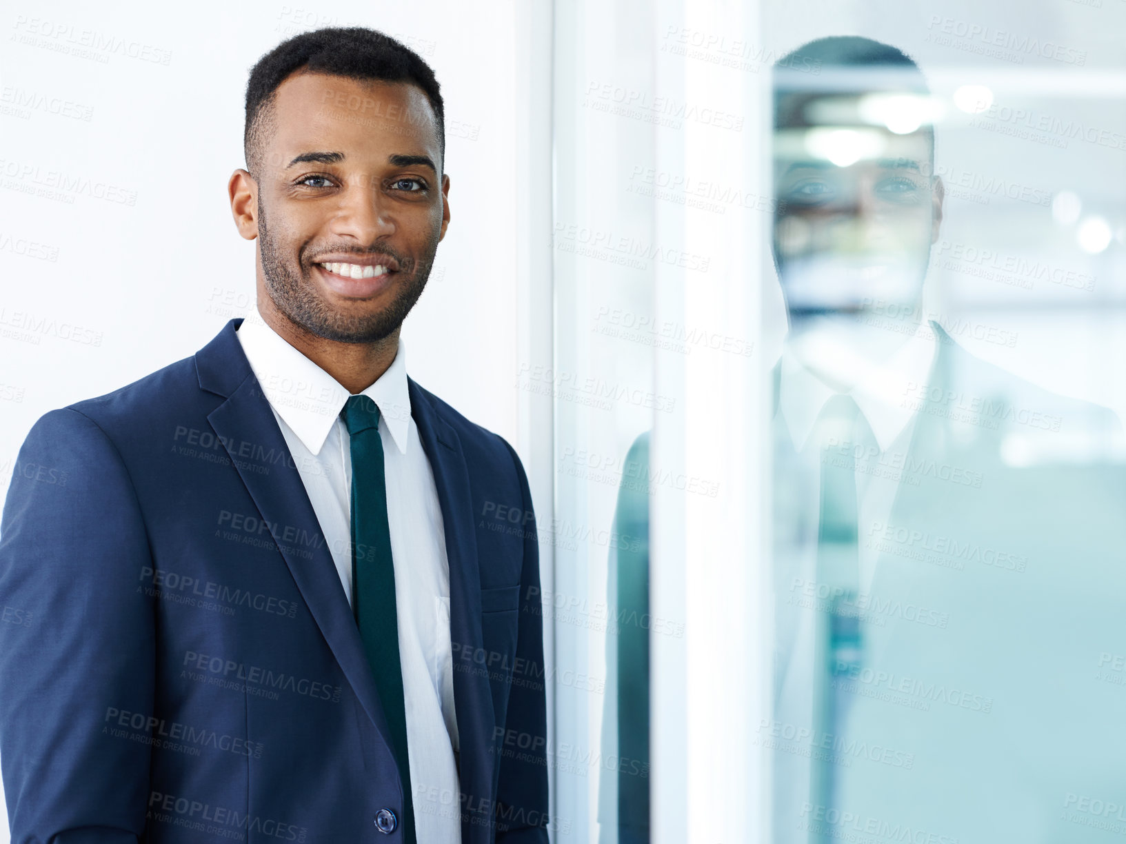 Buy stock photo A handsome young african american businessman standing indoors with a smile