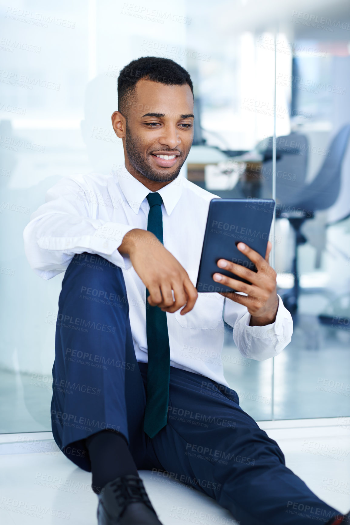 Buy stock photo Connection, businessman and tablet in office for watching, streaming content or education videos for career. Floor, black person or accountant with digital for finance tips, learning or online report