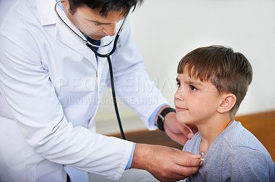 Buy stock photo Cropped shot of a doctor listening to his patient's heartbeat